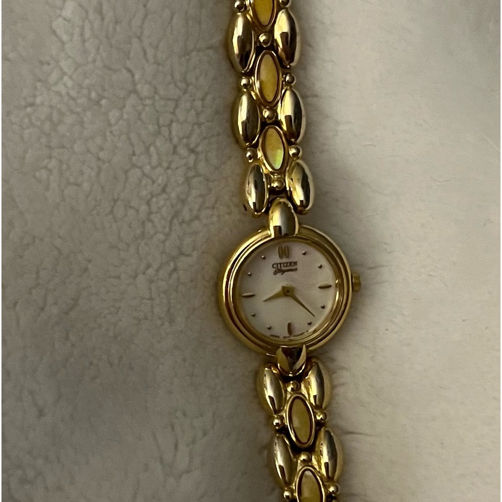 Watch gold plated with opal. Good condition. Needs new battery.